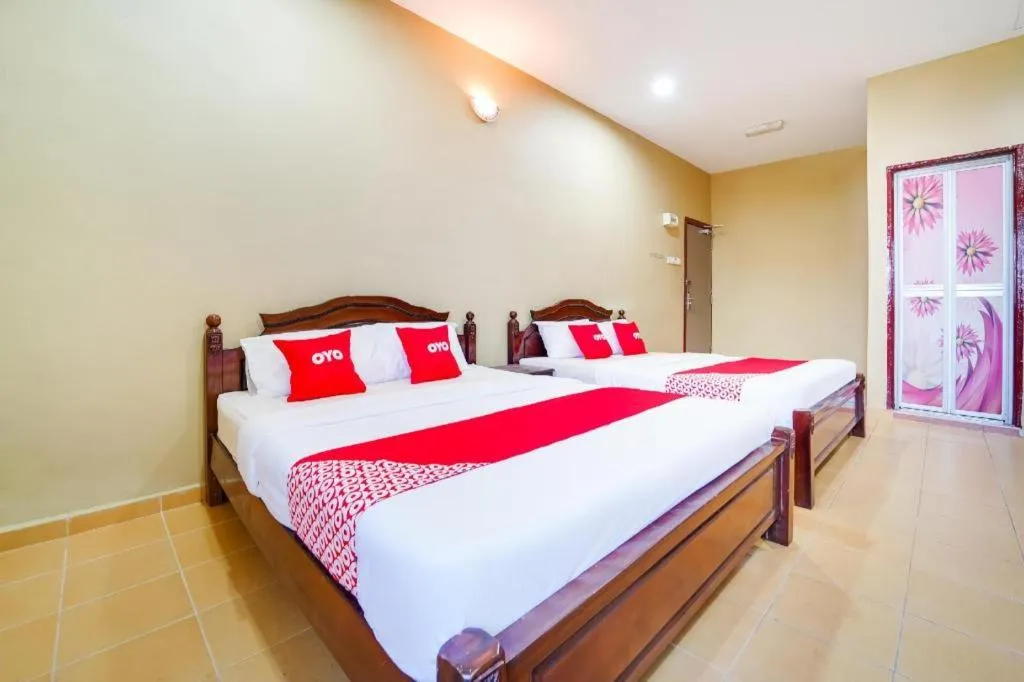 Bed in OYO 44058 MOTEL SRE BAYAM