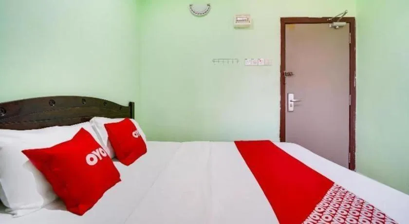 Bed in OYO 44058 MOTEL SRE BAYAM
