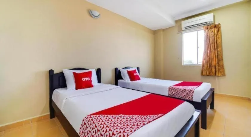 Bed in OYO 44058 MOTEL SRE BAYAM