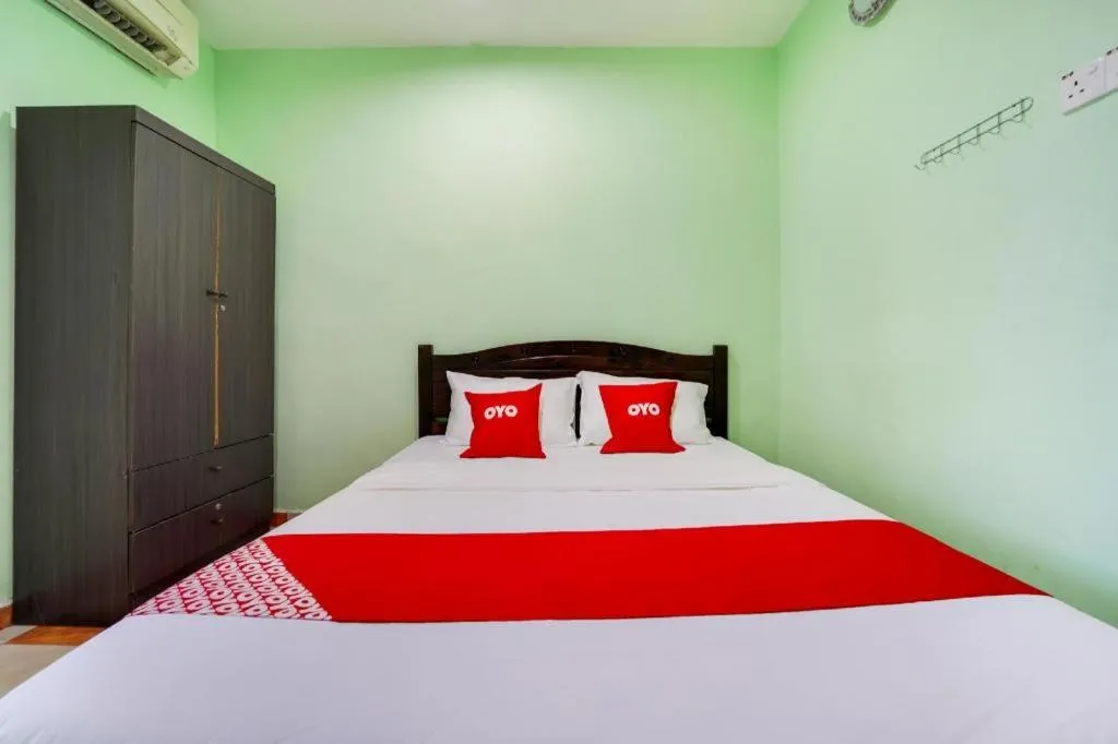 Bed in OYO 44058 MOTEL SRE BAYAM