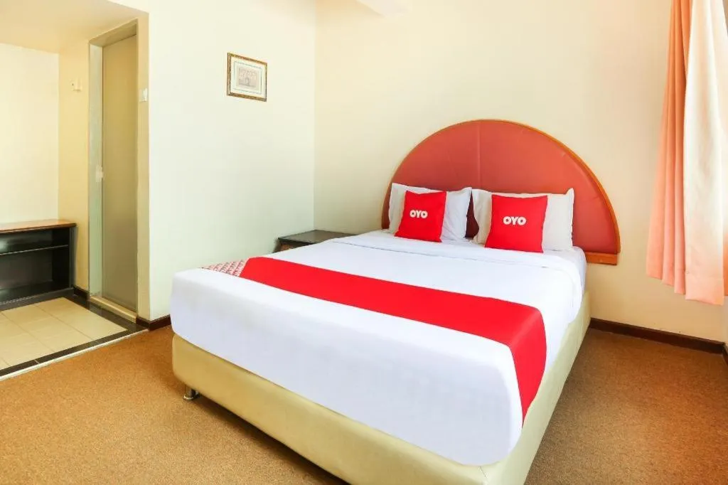 Bed in OYO 89638 Hotel Mandarin Inn