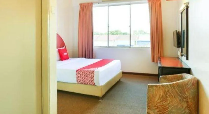 Bed in OYO 89638 Hotel Mandarin Inn