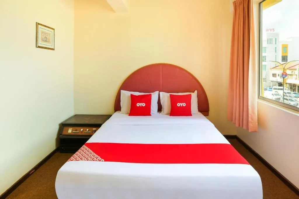 Bed in OYO 89638 Hotel Mandarin Inn