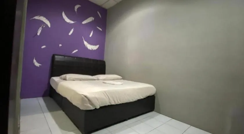 Bed in OYO 89760 Harmoni Inn Hotel