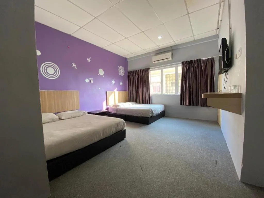 Bed in OYO 89760 Harmoni Inn Hotel