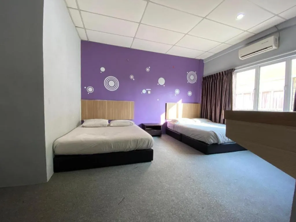 Bed in OYO 89760 Harmoni Inn Hotel