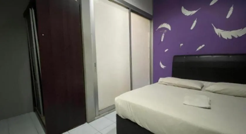 Bed in OYO 89760 Harmoni Inn Hotel