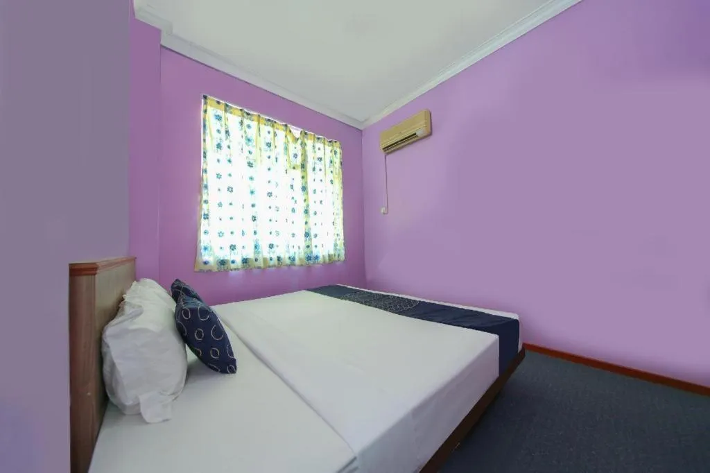 Bed in Capital O 89876 Safari Hotel