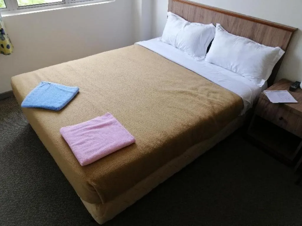 Bed in Capital O 89876 Safari Hotel