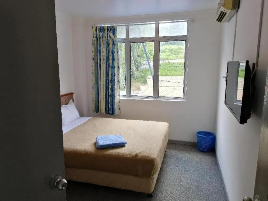 Bed in Capital O 89876 Safari Hotel