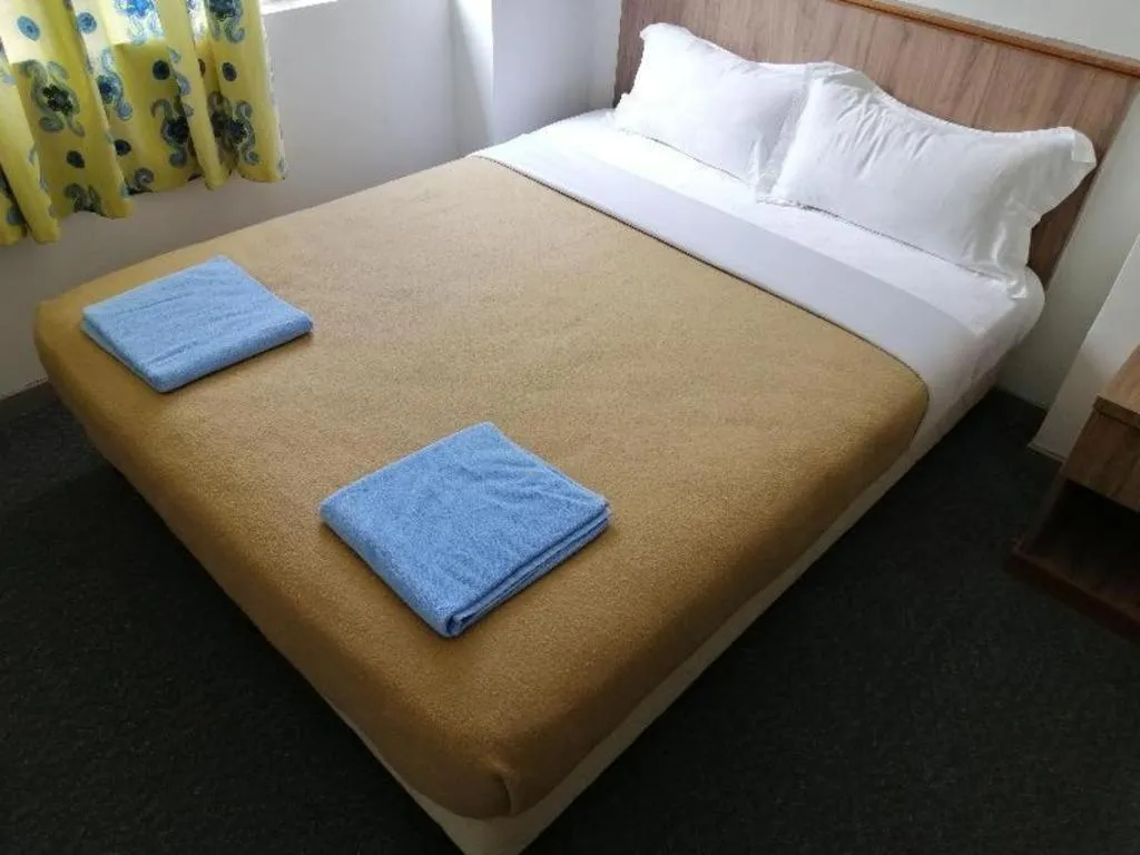 Bed in Capital O 89876 Safari Hotel