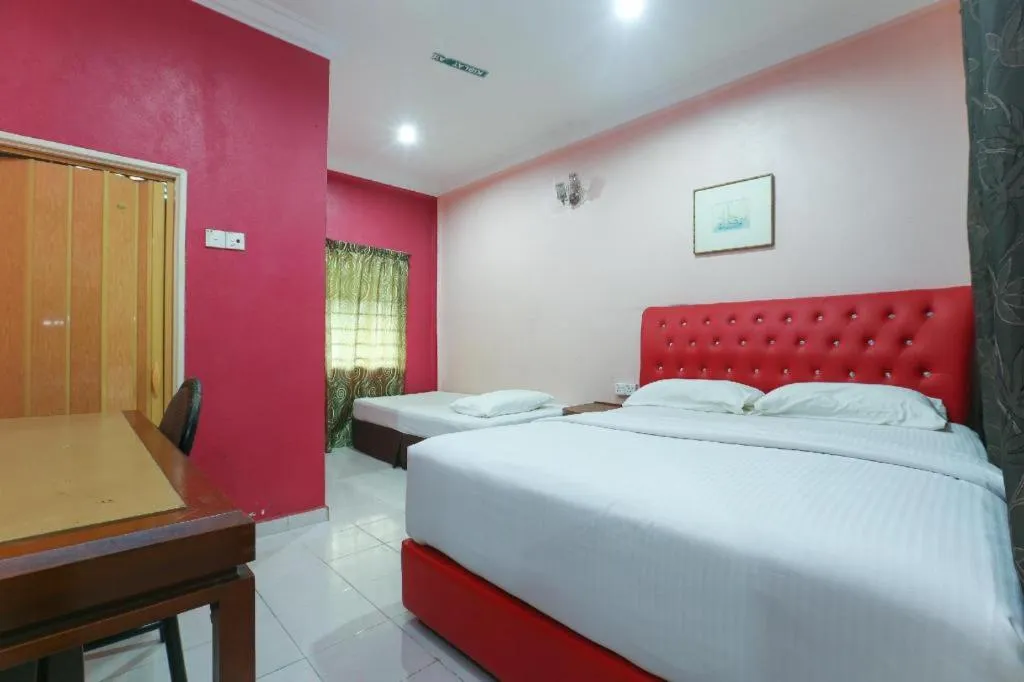Bed in OYO 89892 Hotel Jeli Inn