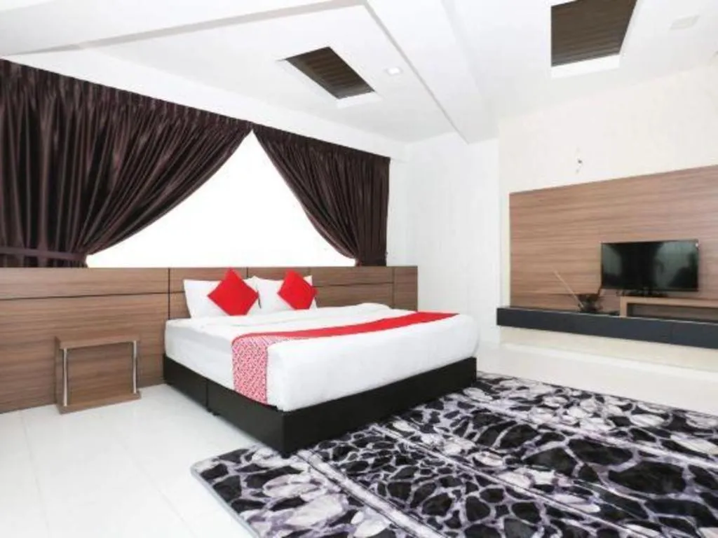 Bed in OYO 89888 DZ Residence Guest House