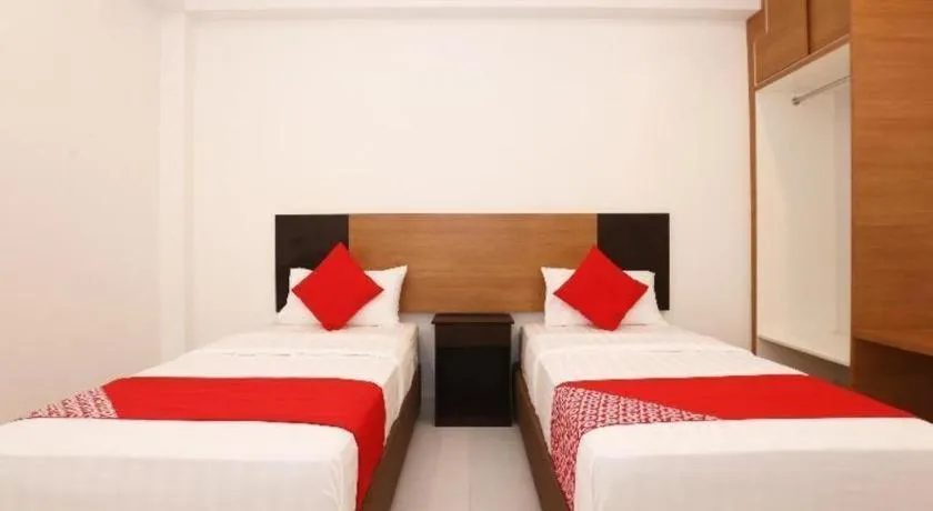 Bed in OYO 89888 DZ Residence Guest House