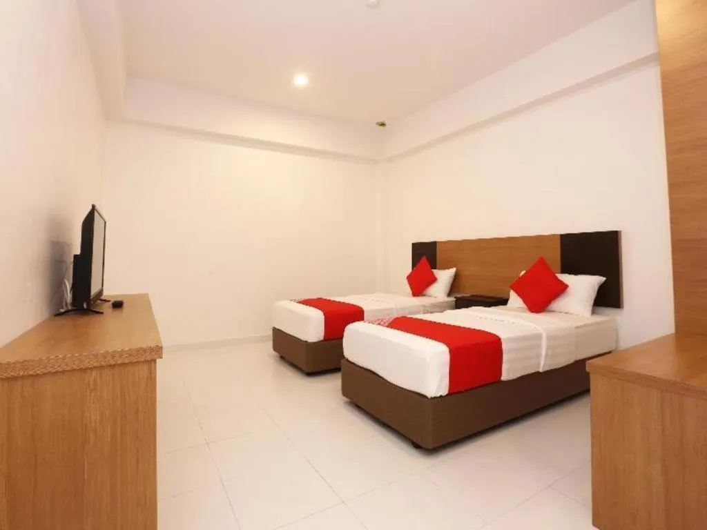 Bed in OYO 89888 DZ Residence Guest House