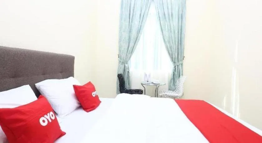 Bed in OYO 89607 Aloha Chalet