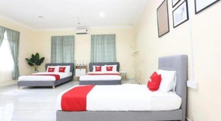 Bed in OYO 89607 Aloha Chalet