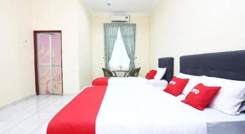 Bed in OYO 89607 Aloha Chalet