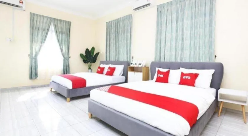 Bed in OYO 89607 Aloha Chalet