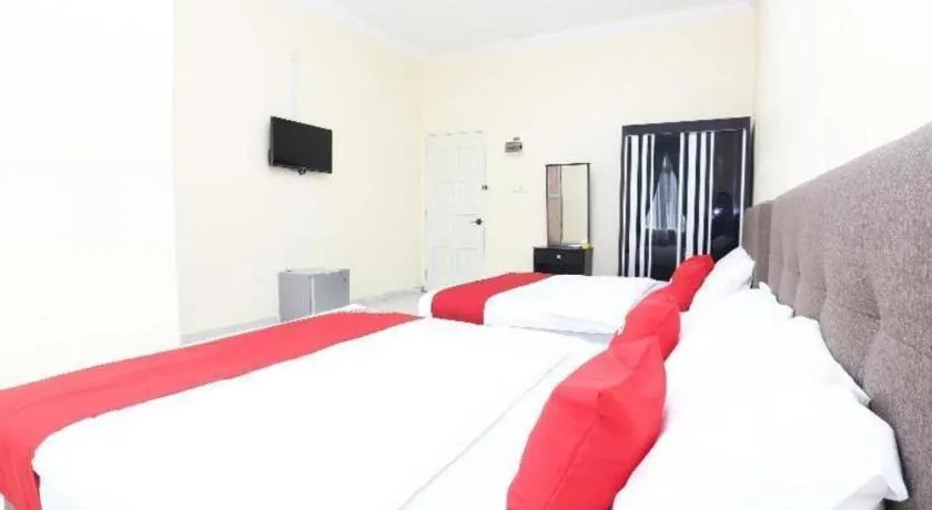 Bed in OYO 89607 Aloha Chalet