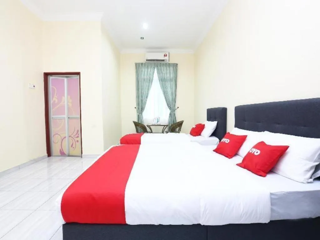 Bed in OYO 89607 Aloha Chalet