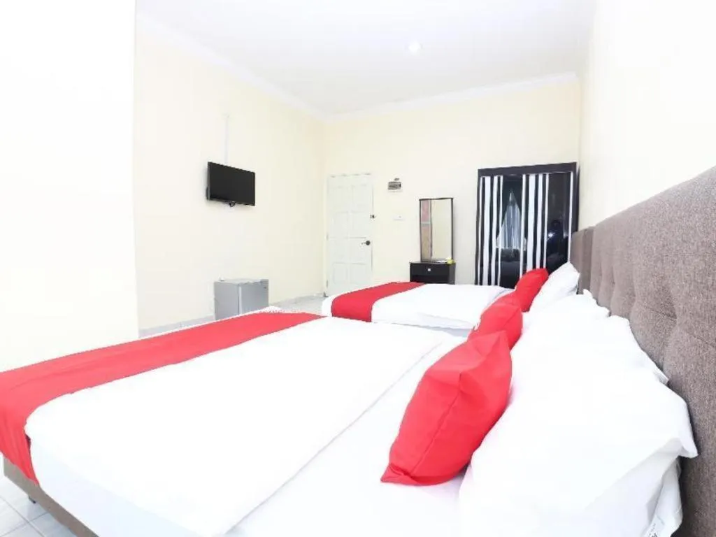 Bed in OYO 89607 Aloha Chalet