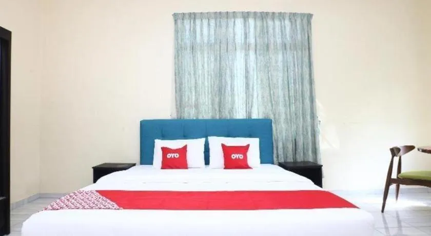 Bed in OYO 89607 Aloha Chalet