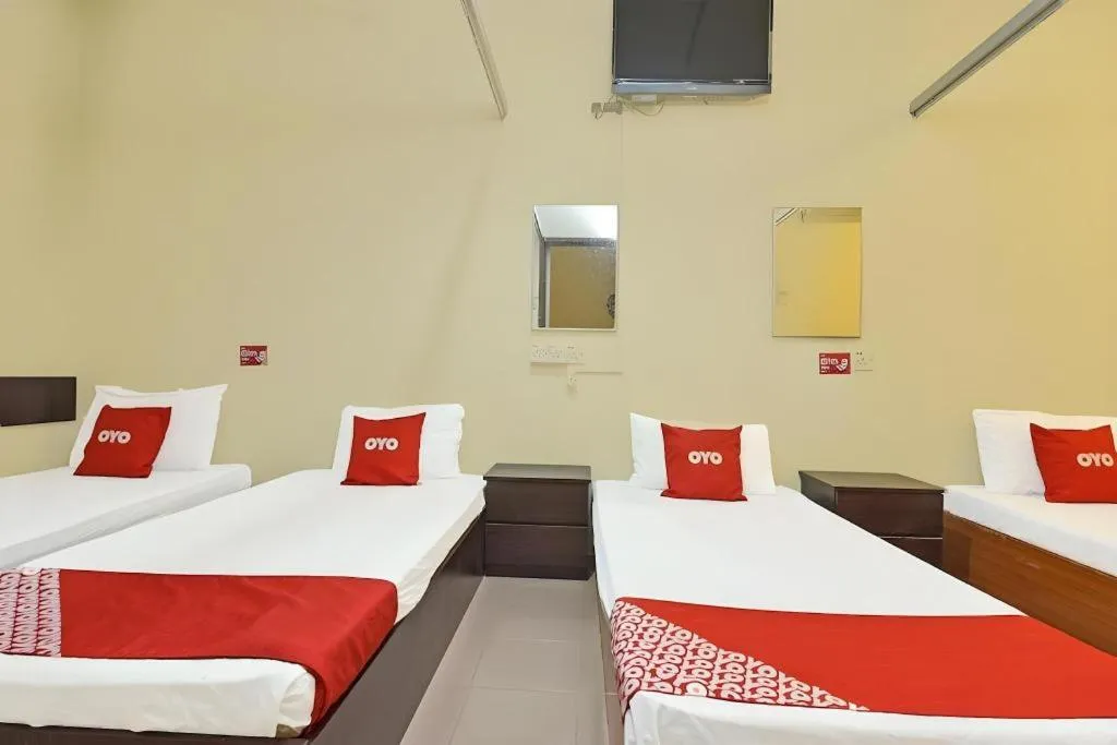 Bed in SPOT ON 91178 Motel Impian