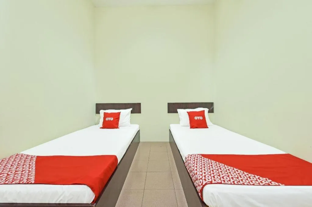 Bed in SPOT ON 91178 Motel Impian