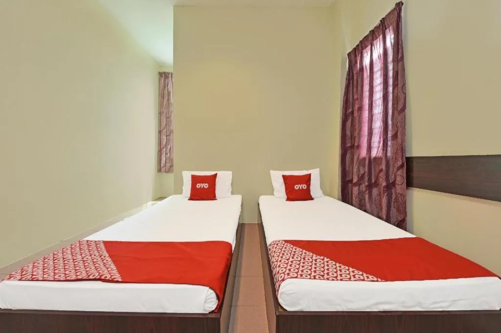 Bed in SPOT ON 91178 Motel Impian