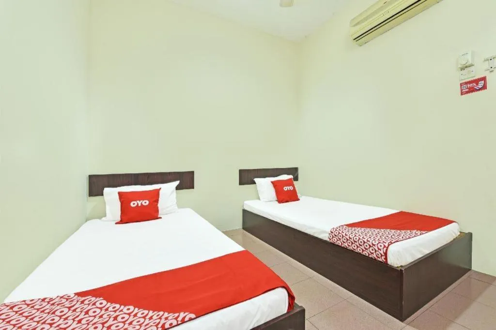 Bed in SPOT ON 91178 Motel Impian