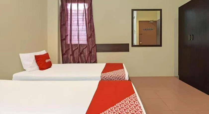 Bed in SPOT ON 91178 Motel Impian