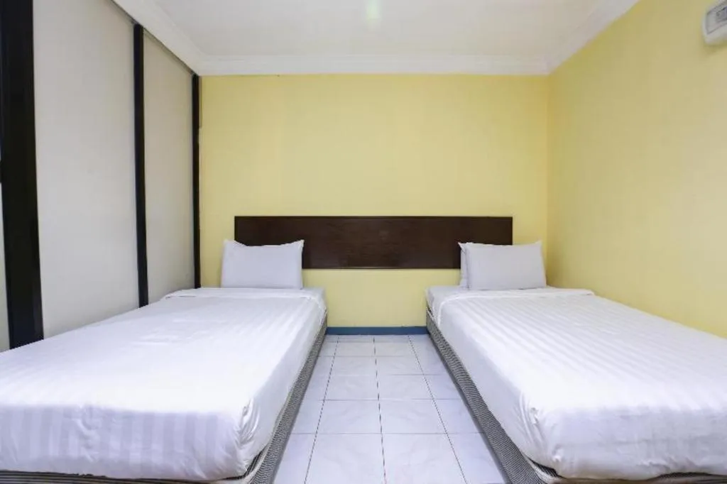 Bed in OYO 89822 Hotel As Salam