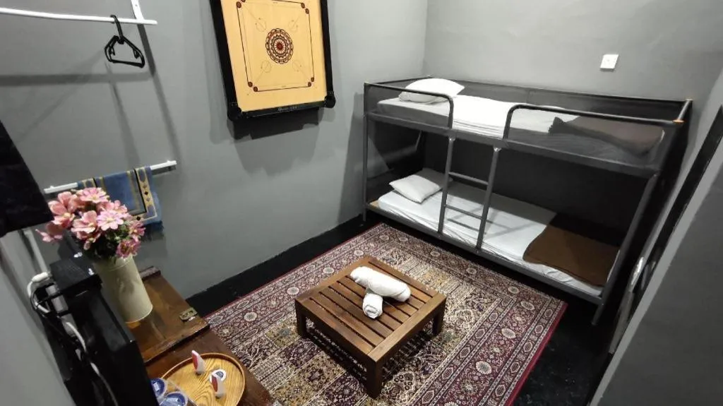 Bed in Oyasumi Hotel