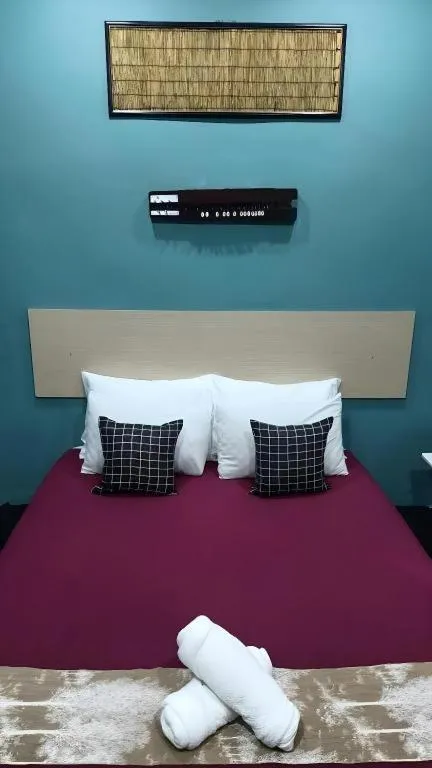 Bed in Oyasumi Hotel