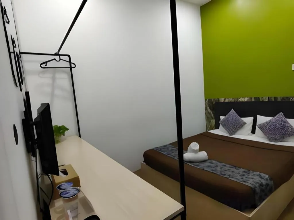 Bed in Oyasumi Hotel