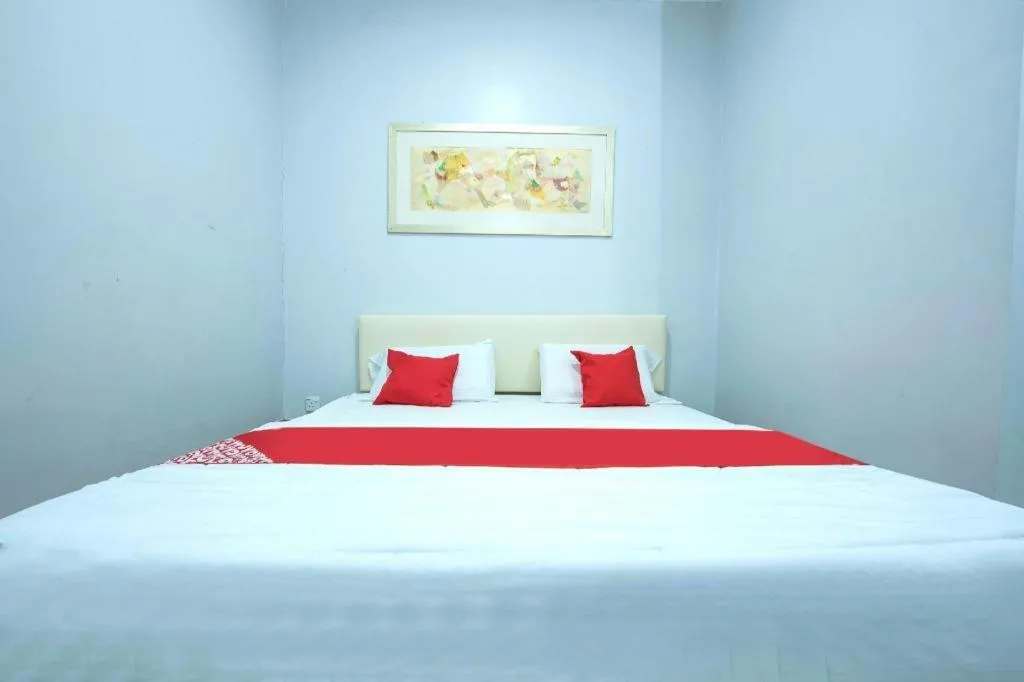 Bed in OYO 90234 Sungai Rengit City Resort 2