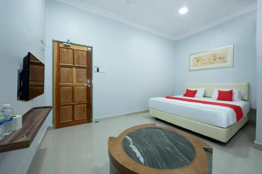 Bed in OYO 90234 Sungai Rengit City Resort 2