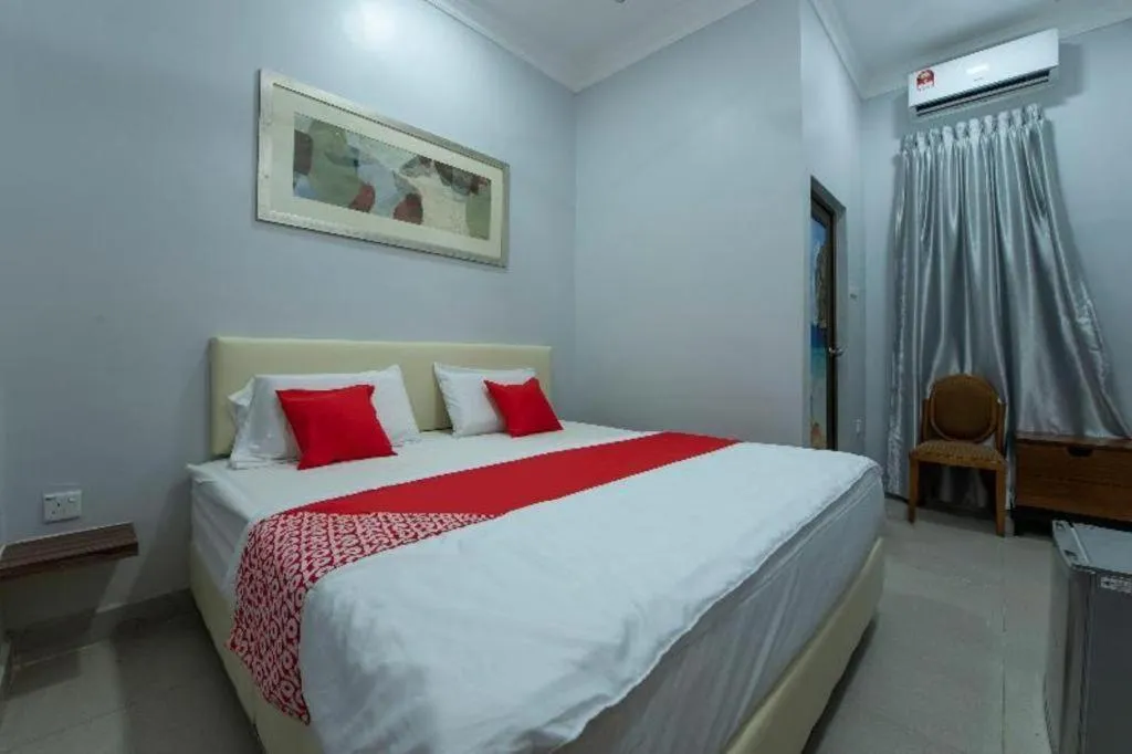Bed in OYO 90234 Sungai Rengit City Resort 2