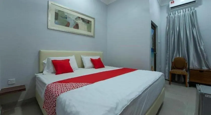 Bed in OYO 90234 Sungai Rengit City Resort 2