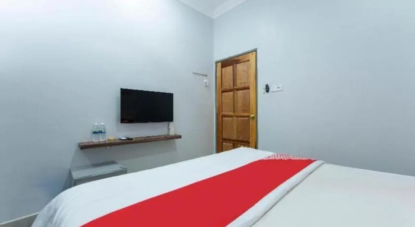 Bed in OYO 90234 Sungai Rengit City Resort 2