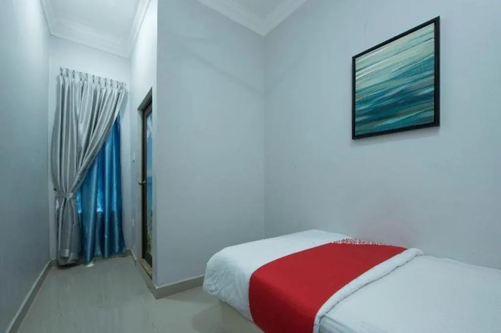 Bed in OYO 90234 Sungai Rengit City Resort 2