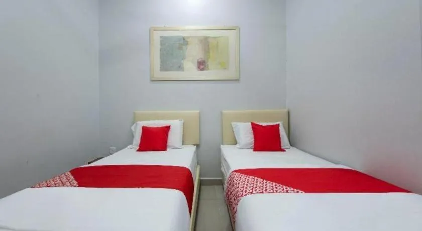 Bed in OYO 90234 Sungai Rengit City Resort 2