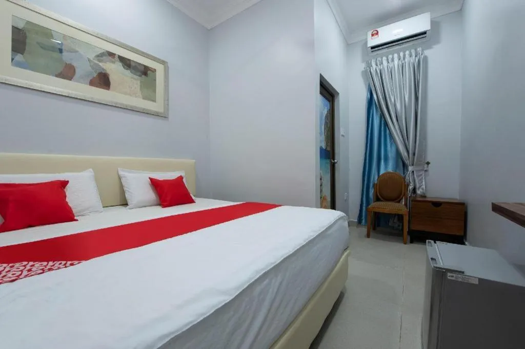 Bed in OYO 90234 Sungai Rengit City Resort 2