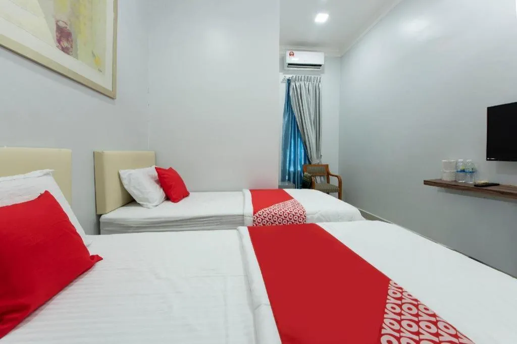 Bed in OYO 90234 Sungai Rengit City Resort 2