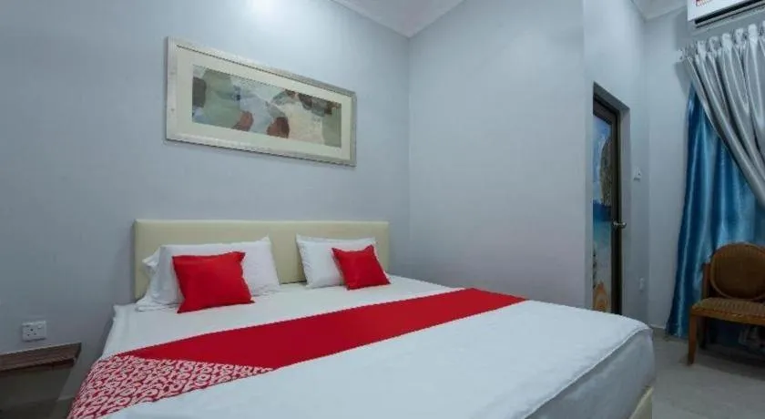 Bed in OYO 90234 Sungai Rengit City Resort 2