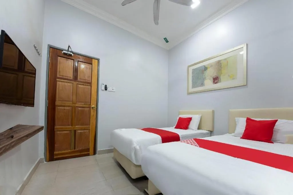 Bed in OYO 90234 Sungai Rengit City Resort 2