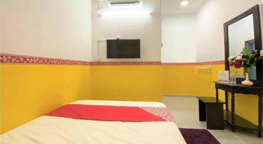 Bed in OYO 90176 D'cruz Sunrise Villa