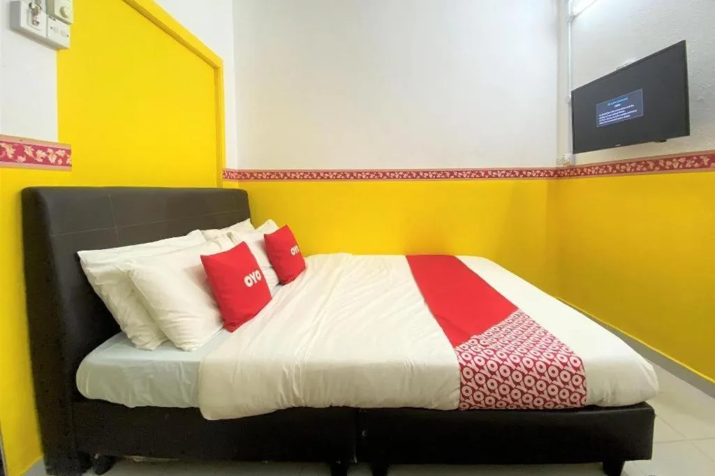 Bed in OYO 90176 D'cruz Sunrise Villa