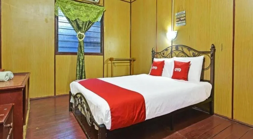 Bed in OYO 90620 Mahseer Chalet